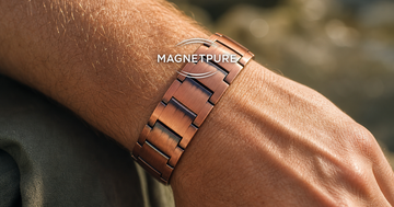 Solid copper magnetic bracelet on a man's wrist in warm sunlight