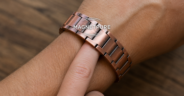 One finger fit test on a copper magnetic bracelet worn on a man's wrist