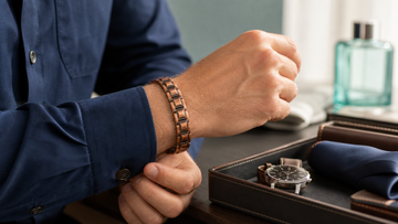 Man wearing a wide copper magnetic bracelet by MagnetPure