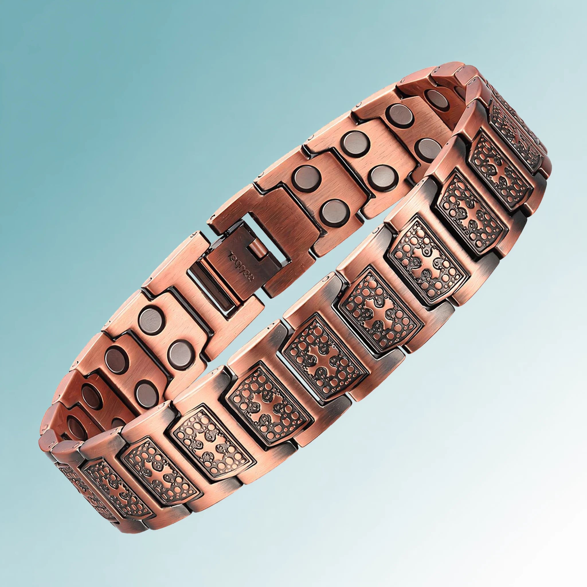 MagnetPure Cross Double Row red copper magnetic bracelet on teal gradient